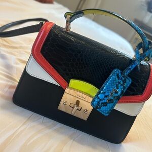 Aldo Black and Red Mini Bag with Blue Accent